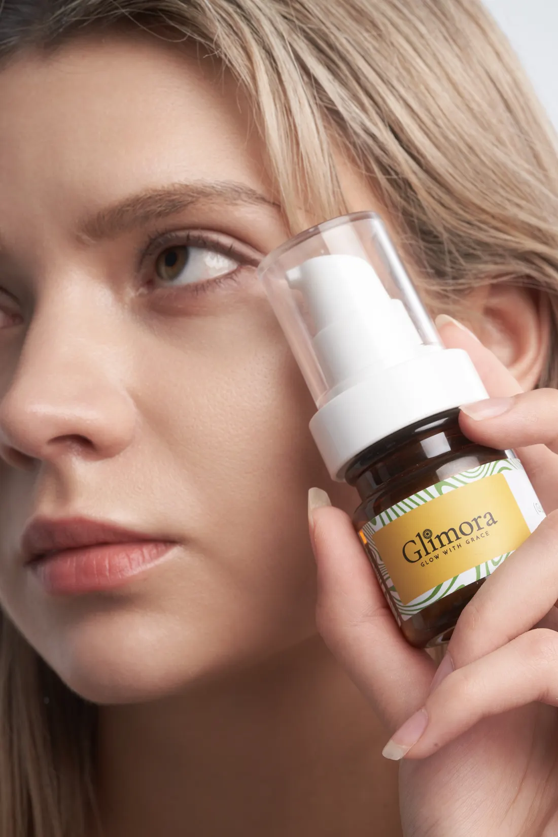 Skincare serum with model, photographed by Southlake Vision in China.
