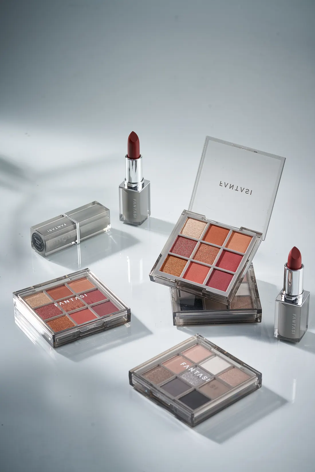 Makeup palettes and lipstick, photographed by Southlake Vision in China.
