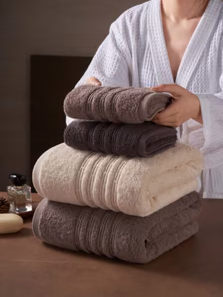 Bath towel collection with a model, home textile product photography by Southlake Vision in China.