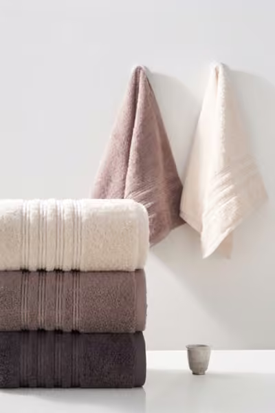 Neutral towel collection in a bathroom, home textile product photography by Southlake Vision in China.