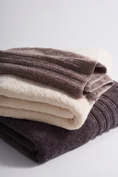 Folded bath towel fabric detail, home textile product photography by Southlake Vision in China.